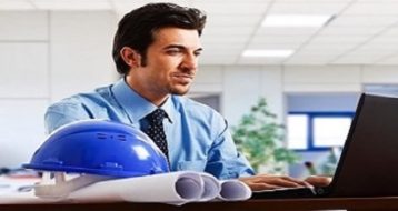 Engineer working at his laptop in the office